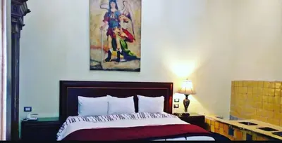 Cama o camas de una habitación en Hotel Real Casa Gloria