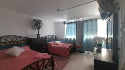 Cama o camas de una habitación en Tranquilo y familiar
