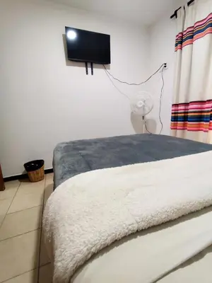 Cama o camas de una habitación en Departamento en el centro de Oaxaca