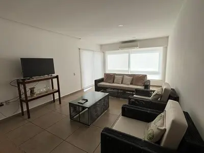 Una televisión o centro de entretenimiento en 9 Bahias Condos con club de playa