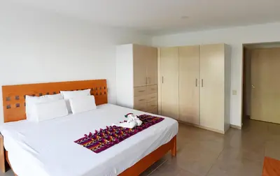 Cama o camas de una habitación en 9 Bahias Condos con club de playa
