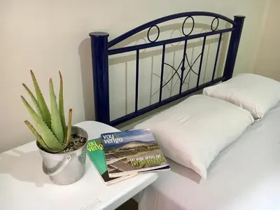 Cama o camas de una habitación en Hostal Andaina