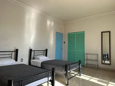 Cama o camas de una habitación en Hostal Andaina