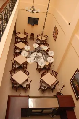 Una televisión o centro de entretenimiento en Hotel Centenario