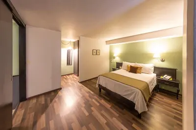 Cama o camas de una habitación en Lusitania Hotel Orizaba