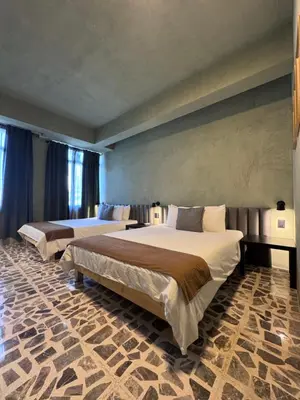 Cama o camas de una habitación en Lusitania Hotel Orizaba