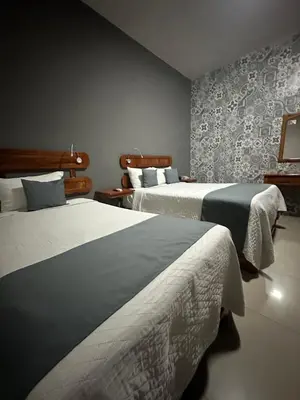 Cama o camas de una habitación en Hotel Pastora