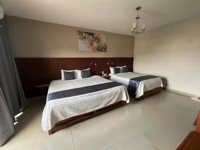 Cama o camas de una habitación en Hotel Pastora