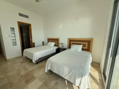 Cama o camas de una habitación en Mayan Playa Departamento Tikal