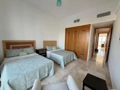 Cama o camas de una habitación en Mayan Playa Departamento Tikal