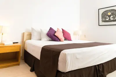 Cama o camas de una habitación en La Cochinilla Hotel Boutique