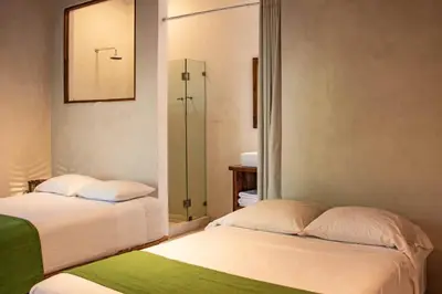 Cama o camas de una habitación en Hotel Noga