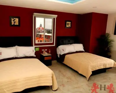 Cama o camas de una habitación en Hotel Leones