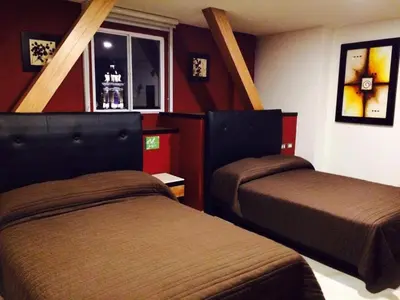 Cama o camas de una habitación en Hotel Leones