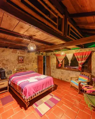 Cama o camas de una habitación en Cabañas Los Achicuales
