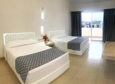 Cama o camas de una habitación en Hotel Huatulco Máxico