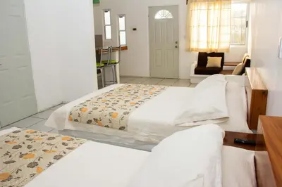 Cama o camas de una habitación en Hotel y Suites Del Paci­fico