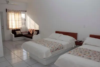 Cama o camas de una habitación en Hotel y Suites Del Paci­fico