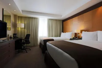 Cama o camas de una habitación en Krystal Urban Aeropuerto Ciudad de Mexico