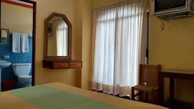 Cama o camas de una habitación en El Tucan