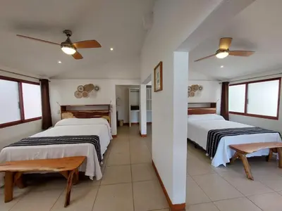 Cama o camas de una habitación en Posada Ziga Playa