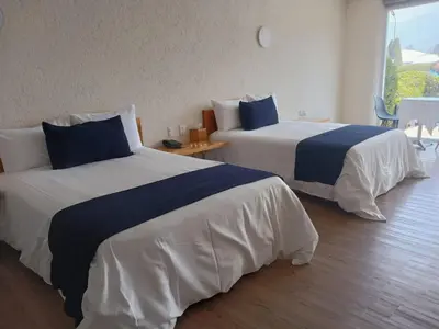 Cama o camas de una habitación en Hacienda Panoaya