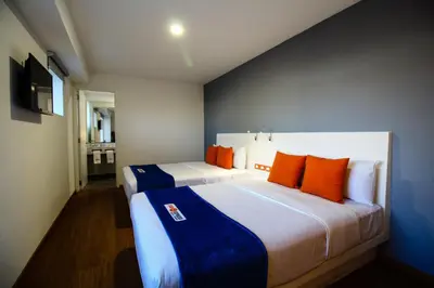 Cama o camas de una habitación en Hotel Star Express Puebla - Central CAPU