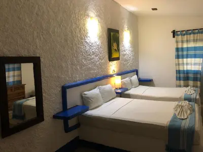 Cama o camas de una habitación en Hotel Arcoiris