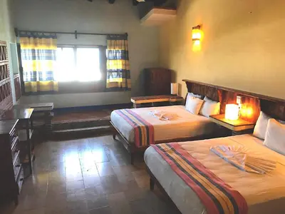 Cama o camas de una habitación en Hotel Arcoiris