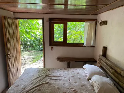 Cama o camas de una habitación en Cabañas Aldea San Francisco de Asís