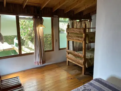 Cama o camas de una habitación en Cabañas Aldea San Francisco de Asís