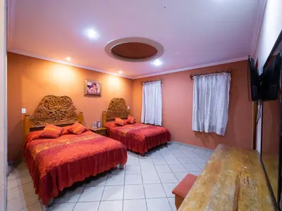 Cama o camas de una habitación en Hotel el Ángel Taxco