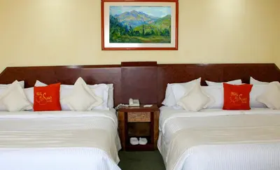 Cama o camas de una habitación en Hotel Real del Sur