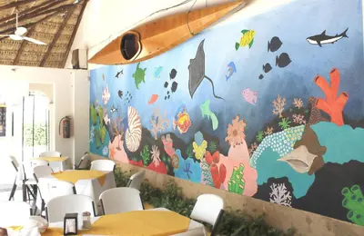 Un restaurante o sitio para comer en Hotel Arrecife Huatulco Plus
