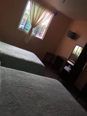Cama o camas de una habitación en Hotel Tierra del Sol Oaxaca