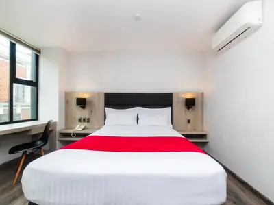 Cama o camas de una habitación en Hotel Nube, Puebla Centro