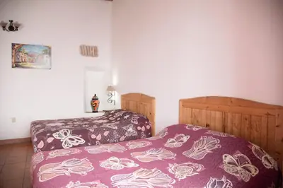 Cama o camas de una habitación en Hotel Rincón Poblano