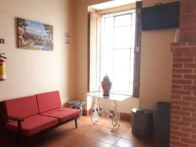 Una televisión o centro de entretenimiento en Hotel Rincón Poblano