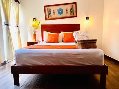 Cama o camas de una habitación en Hotel & Suites Cerro Roj0