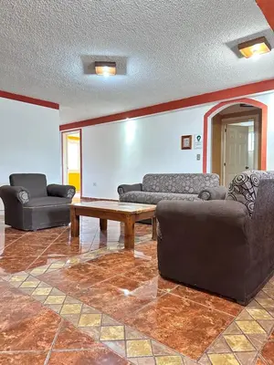 Zona de estar de Hotel & Suites Cerro Roj0