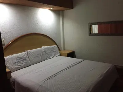 Cama o camas de una habitación en Hotel Paraiso Express