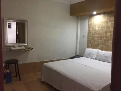 Cama o camas de una habitación en Hotel Paraiso Express