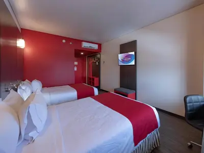 Cama o camas de una habitación en Ramada Encore by Wyndham Puebla