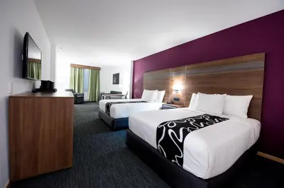 Cama o camas de una habitación en La Quinta by Wyndham San Jose Chiapa Puebla
