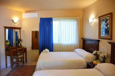 Cama o camas de una habitación en Hotel La Hacienda