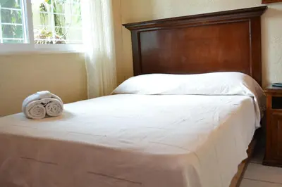 Cama o camas de una habitación en Hotel La Hacienda