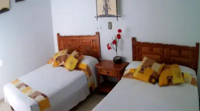 Cama o camas de una habitación en Quinta Belu Oaxtepec