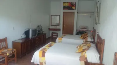 Cama o camas de una habitación en Quinta Belu Oaxtepec