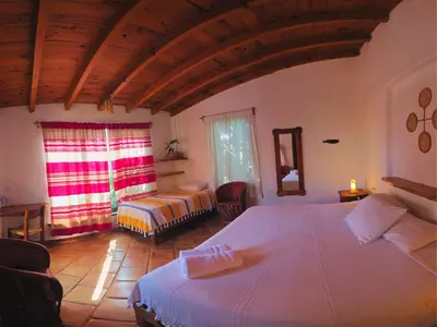 Cama o camas de una habitación en Cabañas el Nido de la Huilota