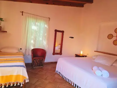 Cama o camas de una habitación en Cabañas el Nido de la Huilota